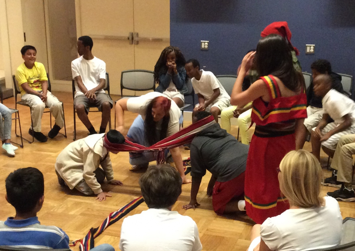 A woman and students plays games