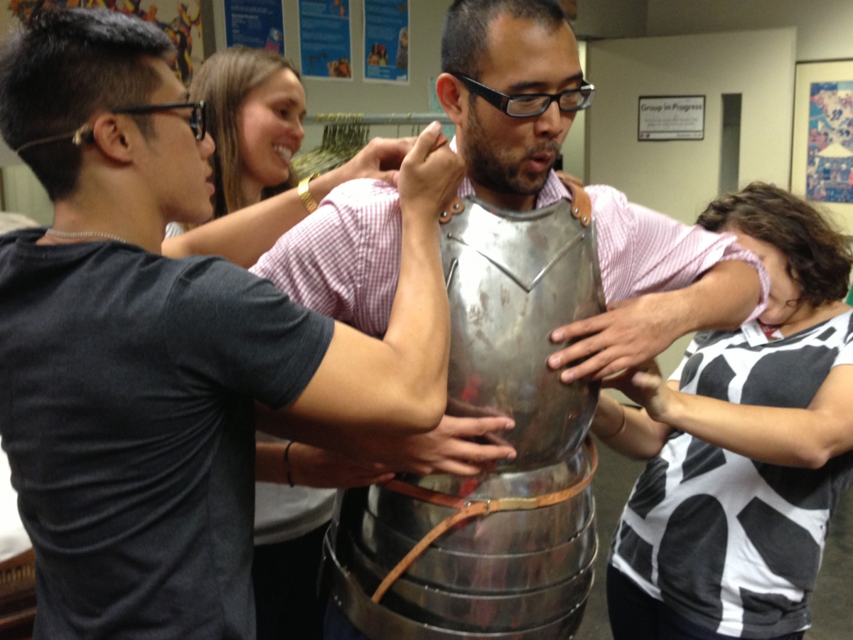 Game Jam team trying on armour