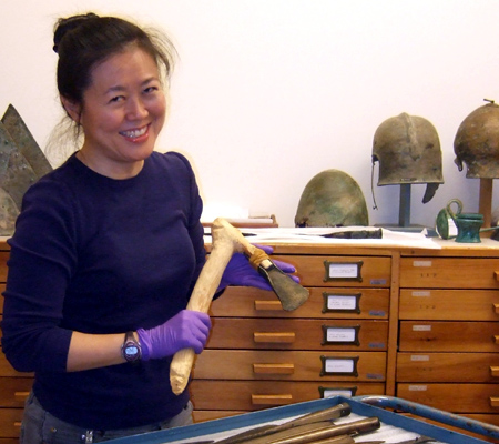 Woman holding an axe head