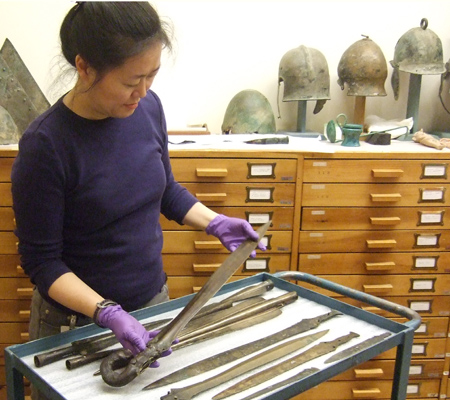 Kay with weapons Different weapons laying on a table