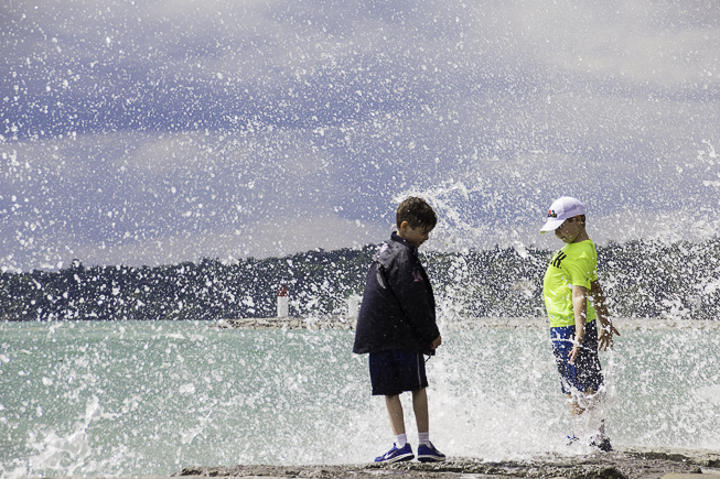 Two young boys appreciating the beauty and power of Lake Ontario. Photo credit: Cristina Bergman