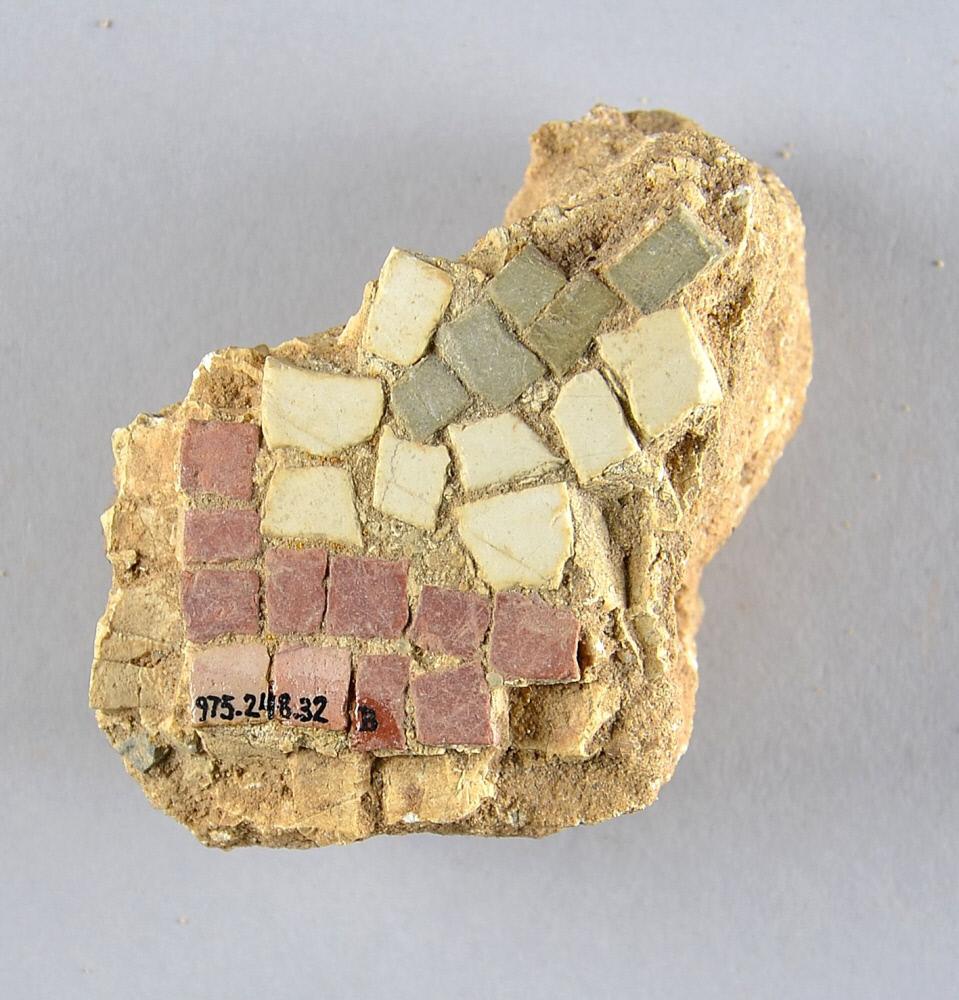 Stone tesserae embedded in cement. ROM Collection: 975.248.32.B
Stone tesserae embedded in cement.