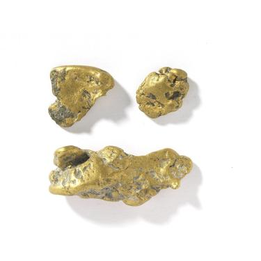 Three yellow gold lumps in three different shapes and sizes.