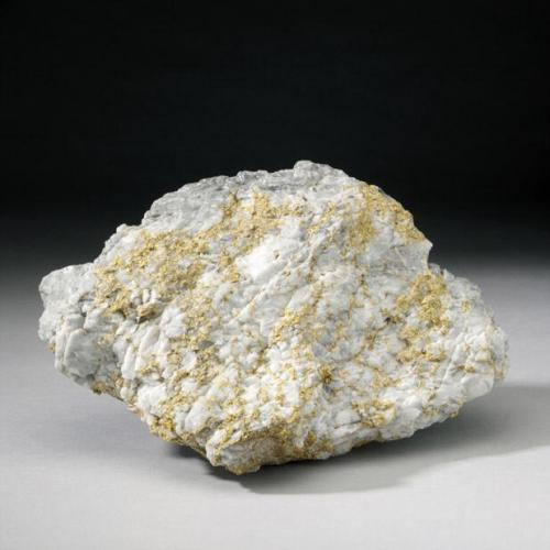 A rock with gold habit
White stone with gold habit
