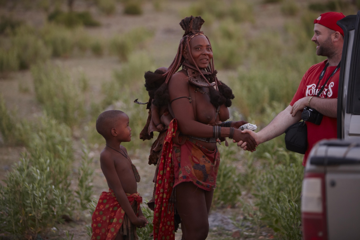 Paul Welhauser greeting a himba woman