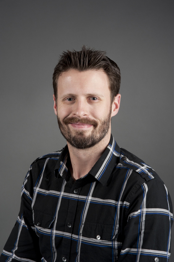 A man poses for a photograph