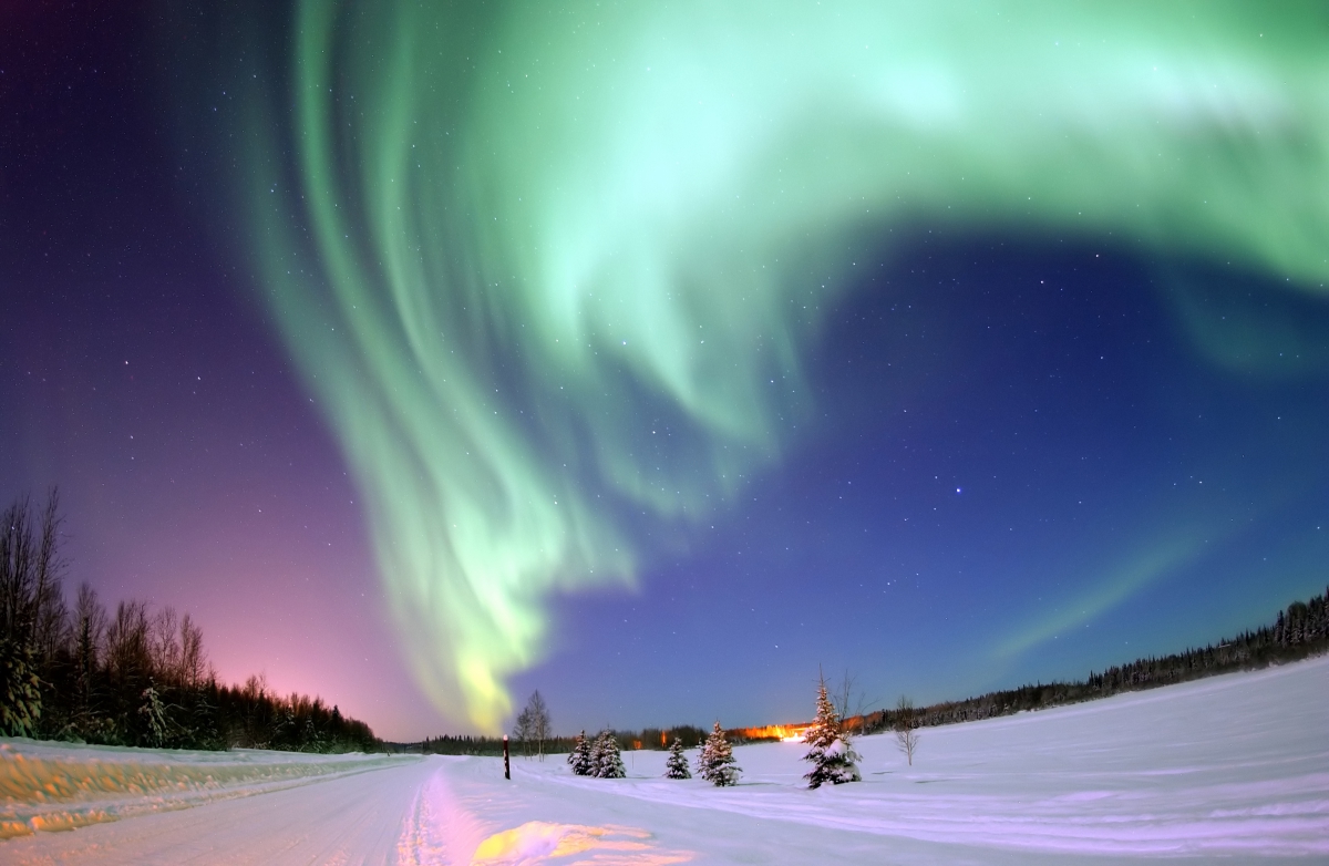 The Aurora Borealis, or Northern Lights, shines above Bear Lake: By United States Air Force photo by Senior Airman Joshua Strang, January 2005 via Wikimedia Commons Attribution.