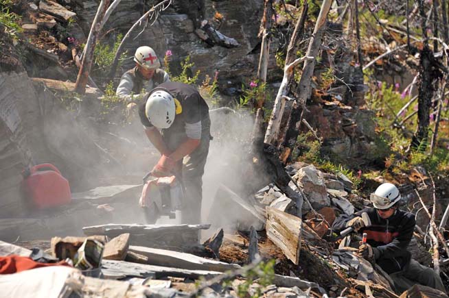 Using a rock saw at the Stephen Formation near Marble Canyon to extract fossils using hammers and chisels (image courtesy of Robert Gaines).