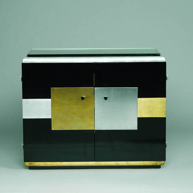 black box with gold and silver panels.