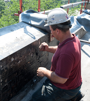 scraping the residue to get a clean surface