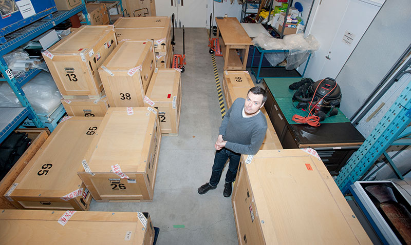 Photo of man with crates the Royal Ontario Museum