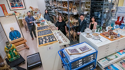 Staff standing in the collections room.