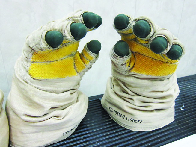 Grey, yellow and white astronaut gloves