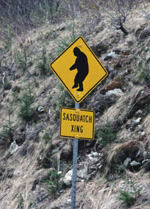 Faked photograph of a "Sasquatch crossing" road sign.