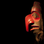 A wooden mask in the Haida style.  Mask at Haida Heritage Centre, Haida Gwaii. © AboriginalBC.com, 2016.