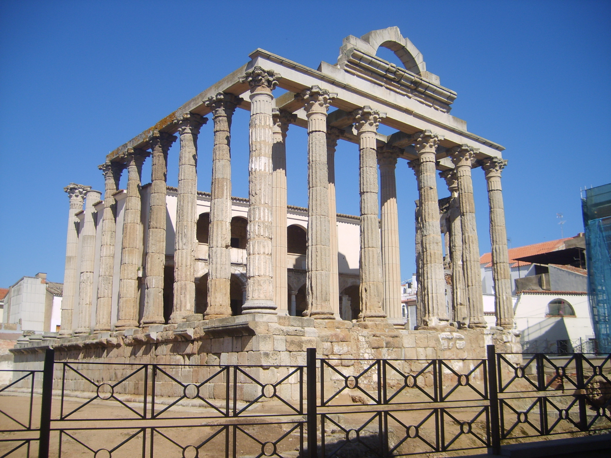 Roman ruins with elaborate columns.