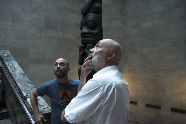 Dave Ireland and Bill Burns considering the acoustics of the totem pole stair case. Photo by Teghan Dodds