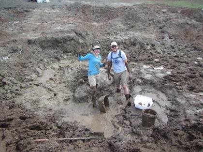 People standing in mud