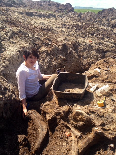 Danielle Dufault with the Triceratops pelvis bone