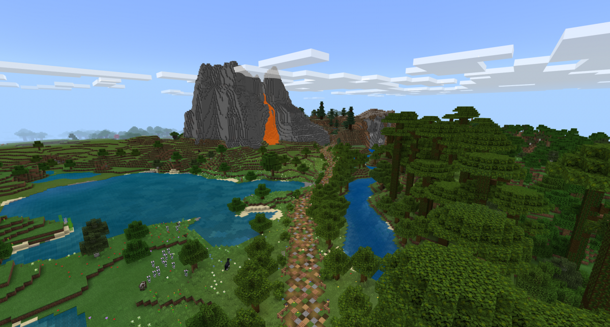 Capture d’écran du jeu Minecraft montrant un paysage rural et un sentier menant à un grand volcan dont s’échappe de la lave.