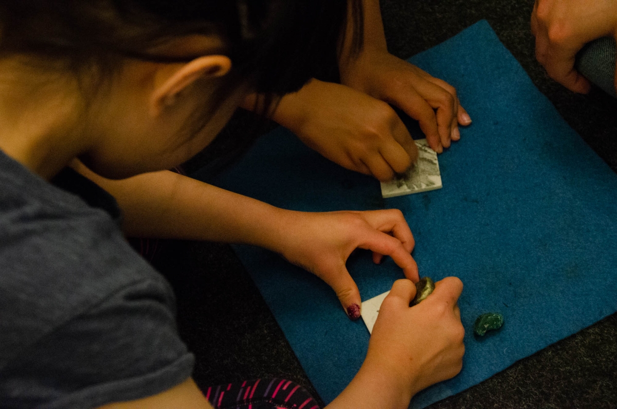 Bethany and her class look at hands on specimens from the Rocks and Minerals collections. Image: Michael Berger