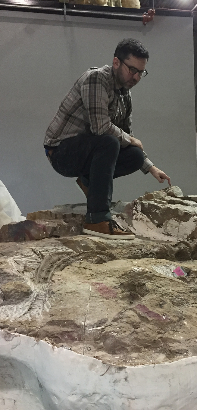 Photo of a man squatting on top of the block