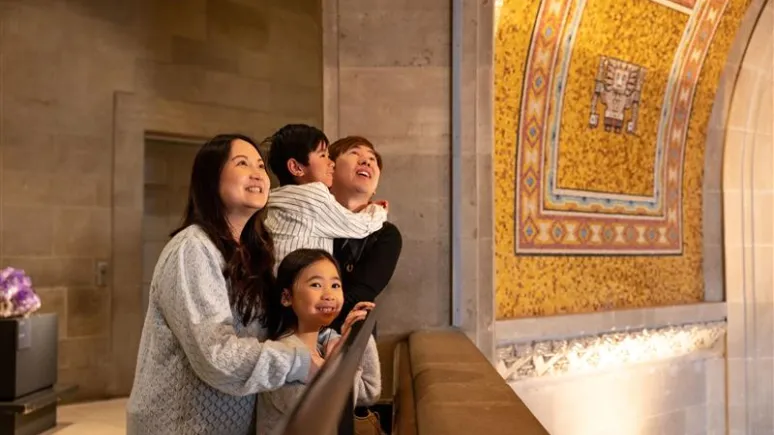 Family looking up at the Rotunda ceiling. 