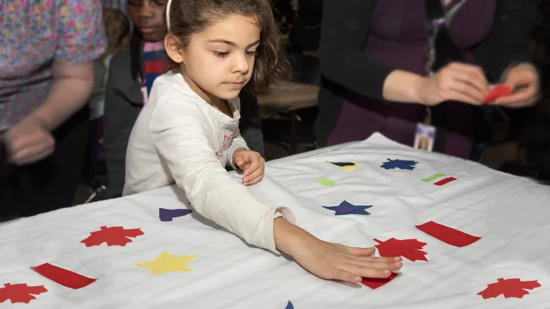 Young visitor enjoys Canada Day at ROM