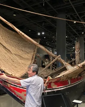 Many touching a canoe