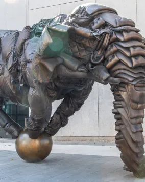 Artwork with figure balanced on a ball