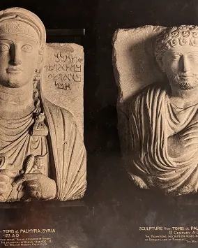 Relief sculptures of a woman and a man from Palmyra, Syria, with inscriptions below each figure.