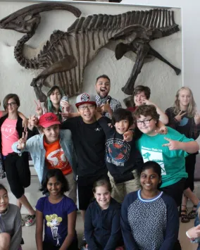 ROM kids volunteers explore the Dinosaur Gallery.

