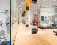 A gallery full of various pottery, ceramics, and statues.