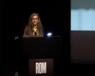 Woman standing on stage.