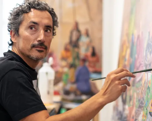 Kent Monkman Studio / Michael Seleski Image of Kent Monkman painting