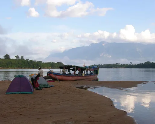 The 2005 Venezuela expedition B-team sets up camp on an upper Orinoco River beach in the shadow of Cerro Duida.