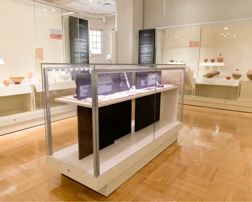 A gallery displaying a collection of African objects including pottery.