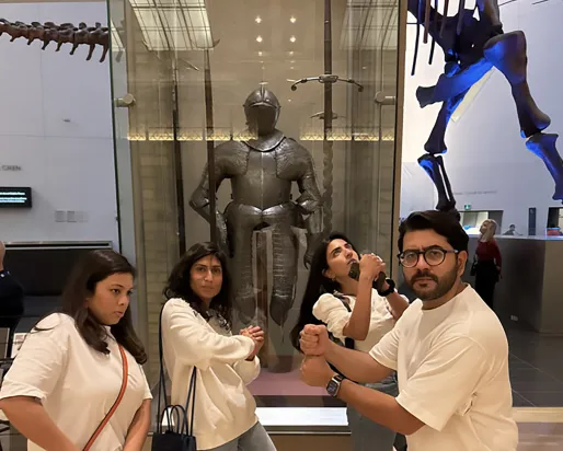 4 ROM guests posing with imaginary swords