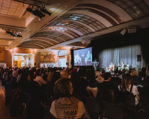 Crowd of people sitting at a ROM Speaks event