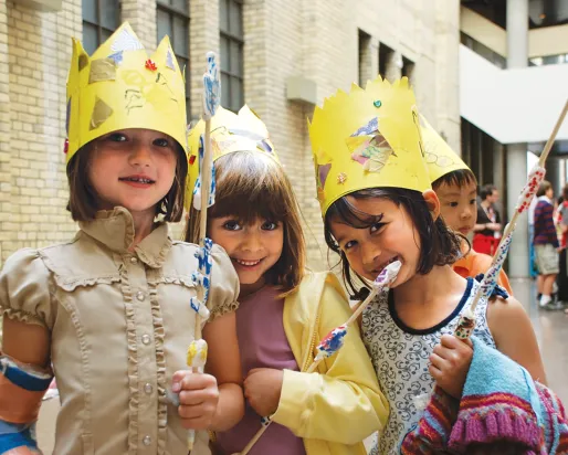 3 children with crowns enjoying birthday party celebrated at ROM