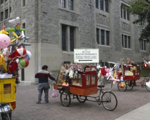 A popcorn cart in the middle of the street.