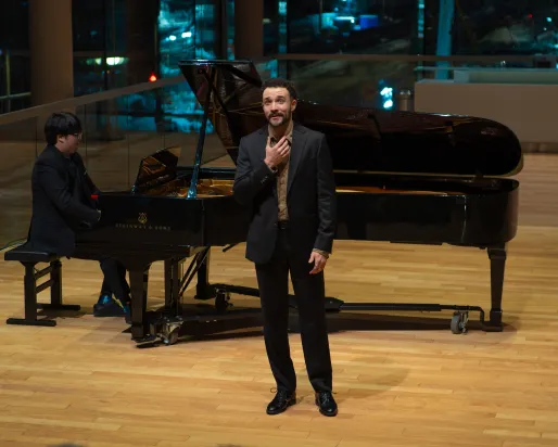 Wesley performing while Brian plays the piano