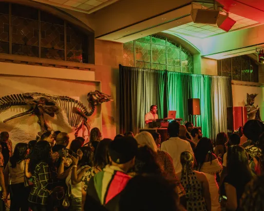 A dj performing at a museum.