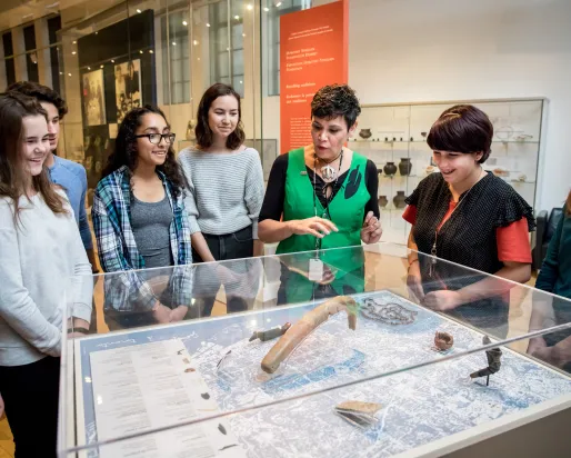 Instructor explaining collection item to students