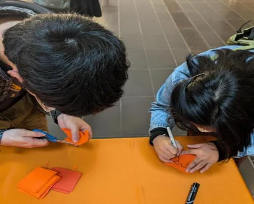 2 students doing arts and crafts