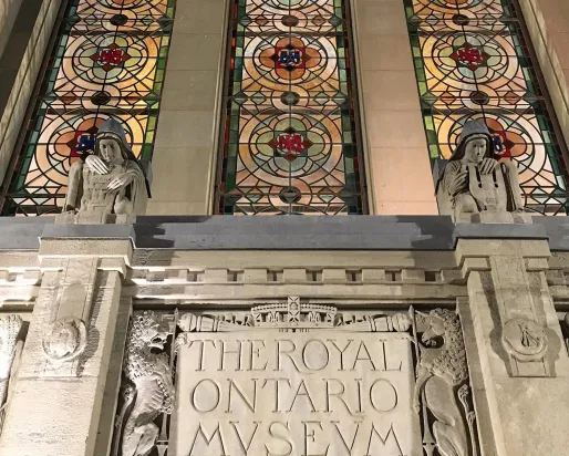 Image of the exterior Queen's Park entrance stained glass windows and architecture