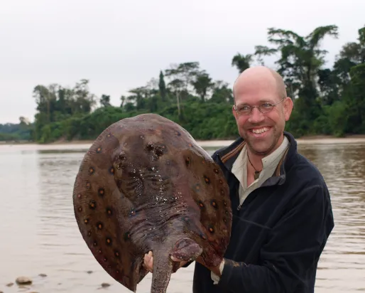 Nathan Lujan with a freshwater ray