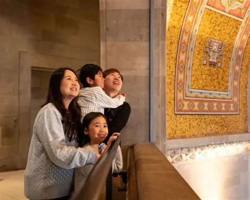 Family looking up at the Rotunda ceiling. 