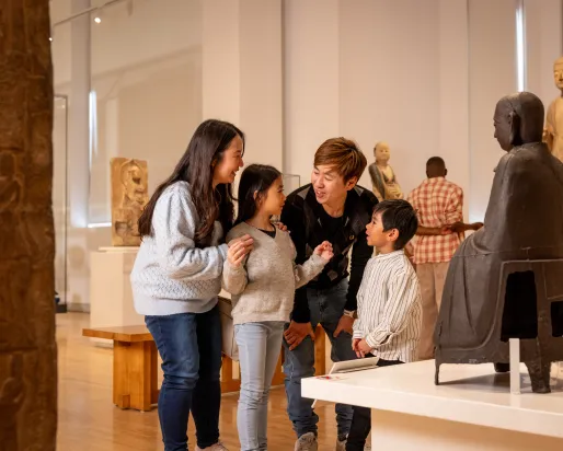 Asian family in the China Gallery of a museum.