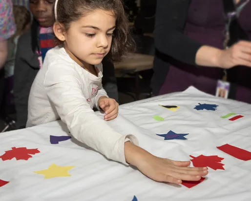Young visitor enjoys Canada Day at ROM